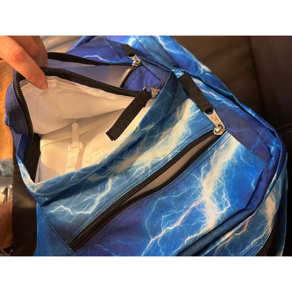 NWOT JanSport Back Pack, Blue Lightening. Multi Zip Pockets